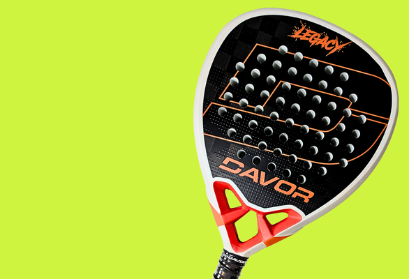 Davor Legacy padel racket in black and white with orange graffiti-style branding, shown against a bright lime green background