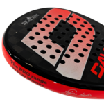 Close-up of the Beacon Davor padel racket face showing the perforated hole pattern, textured finish, and red-to-white gradient “D” graphic on a black background.